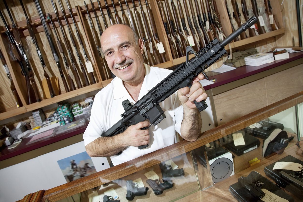 Happy Gun Store Owner